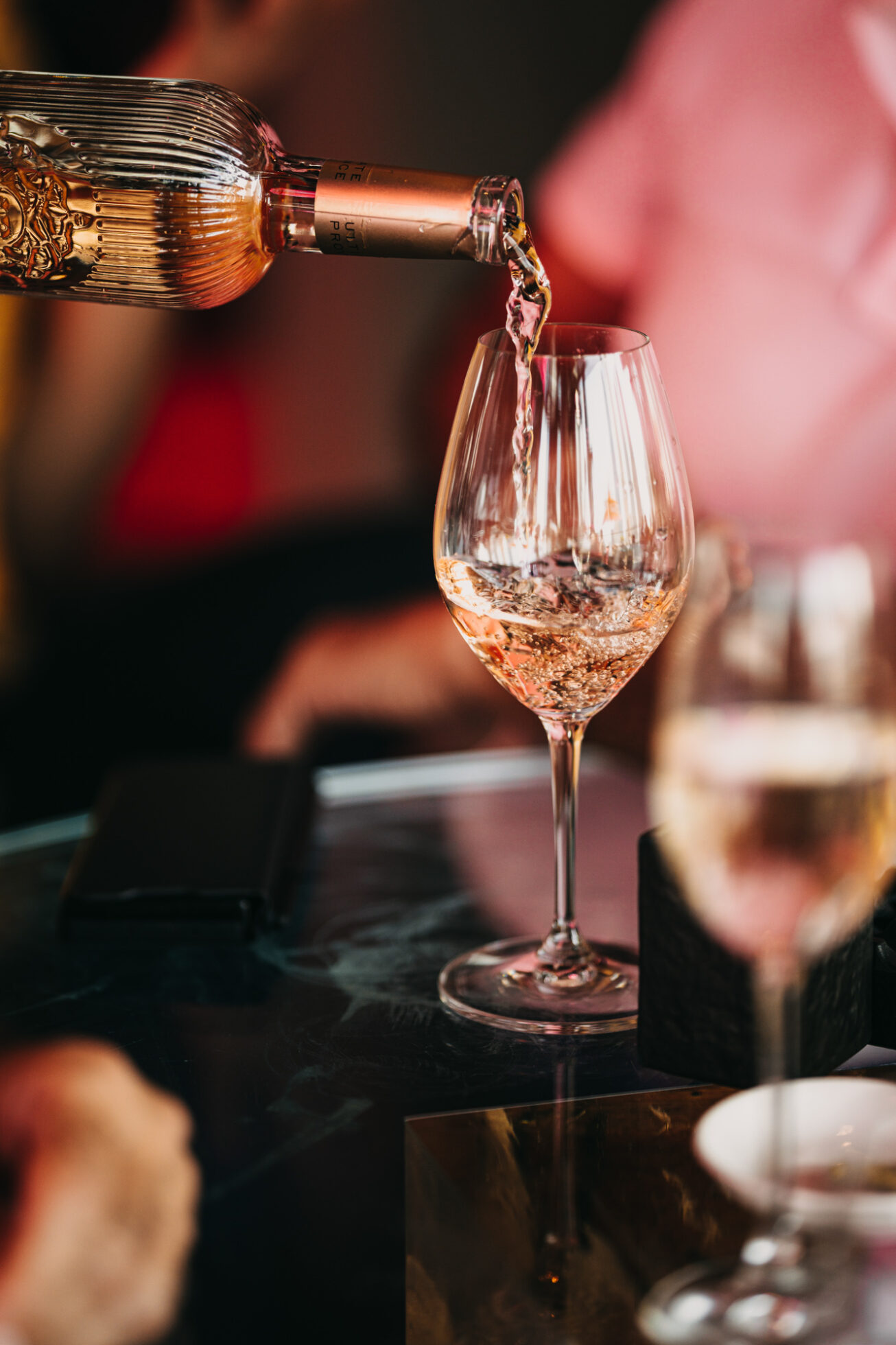 wine being served at CLAP Dubai, a japanese fine dining restaurant